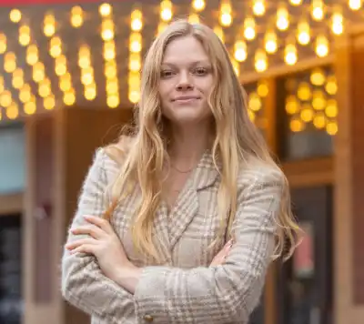 image of a woman in a tan blazer